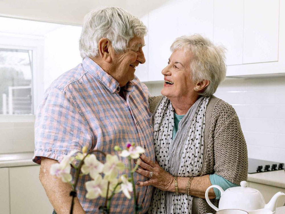 An older couple embracing An older couple embracing