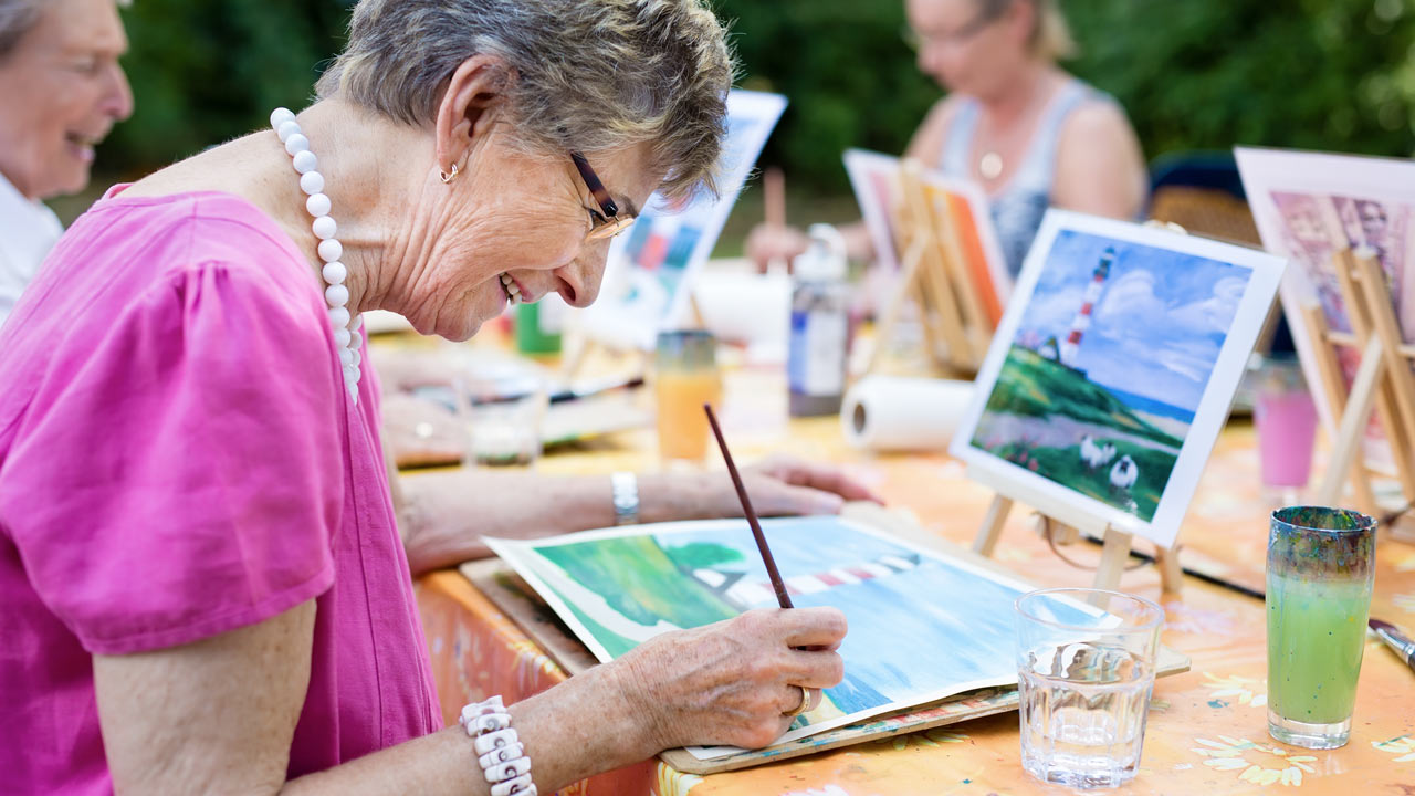 Senior lady painting