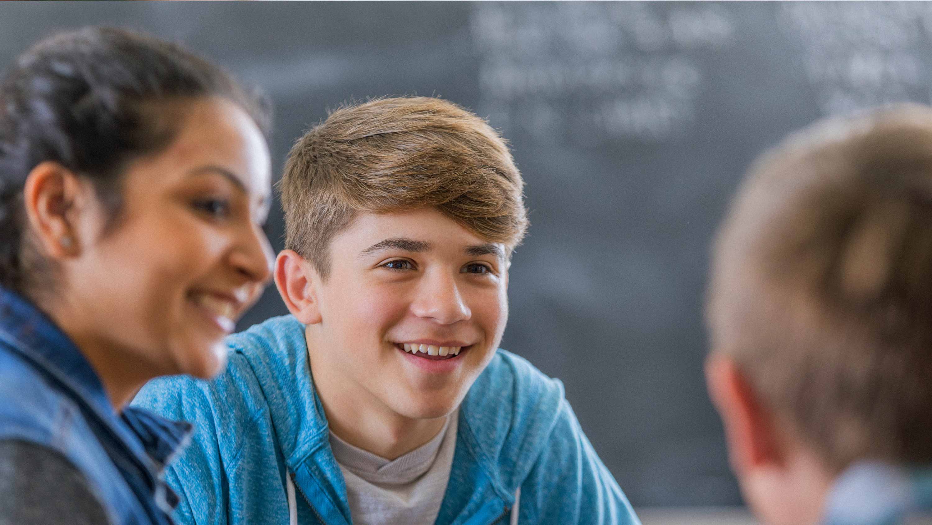 A high school aged child talking excitedly