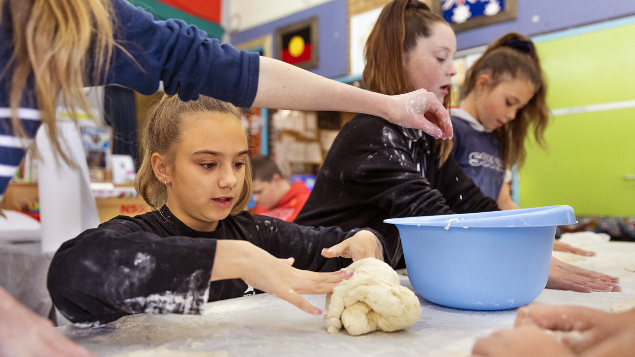 Group of school children baking. Group of school children baking.