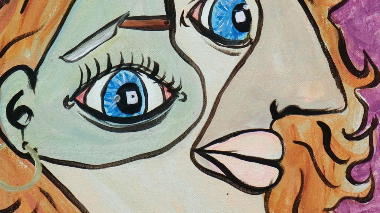 One of the artworks. A woman's face in the style of Picasso.